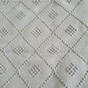 Tapis vert pastel réalisé à la main au Portugal